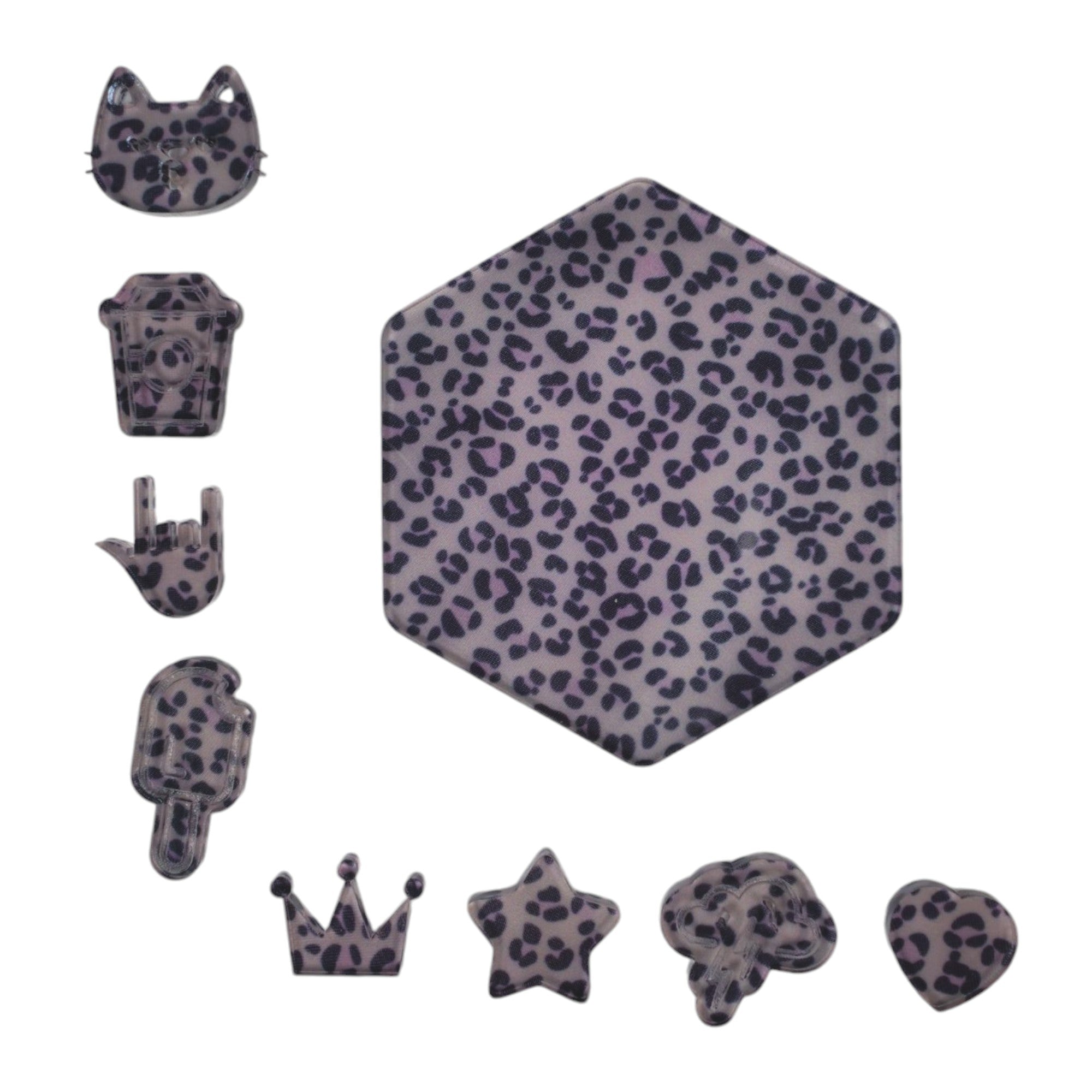 Acrylic supplies including diffuser sheets with a leopard pattern.