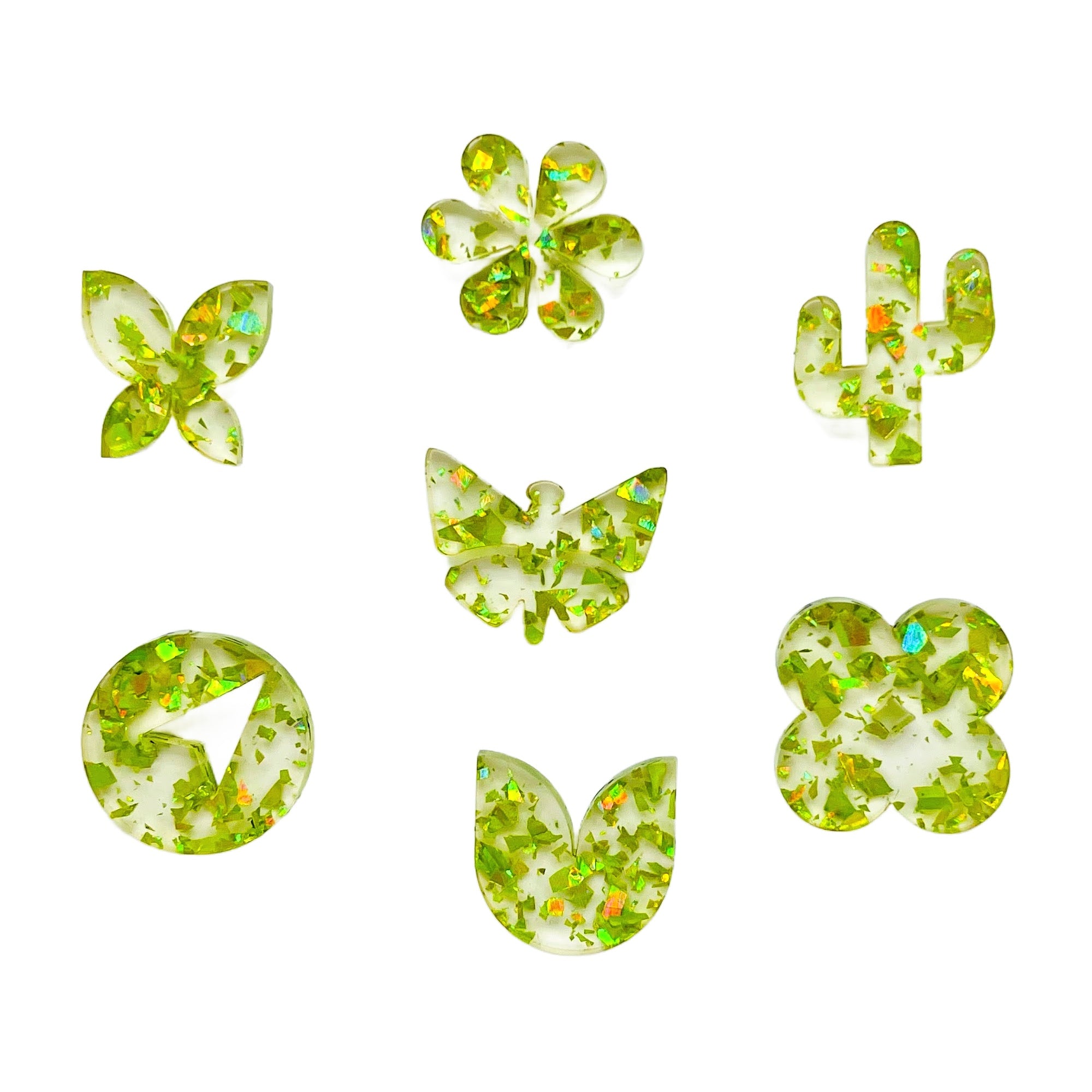 glitter laser cut acrylic shapes of clear sheet plastic with neon lime glitter confetti - ideal for laser cutting and crafting.