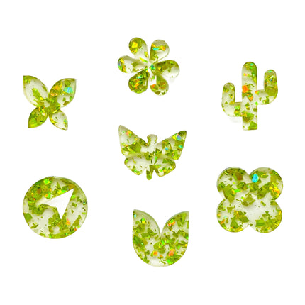 Glitter laser cut acrylic shapes of clear sheet plastic with neon lime glitter confetti - ideal for laser cutting and crafting.