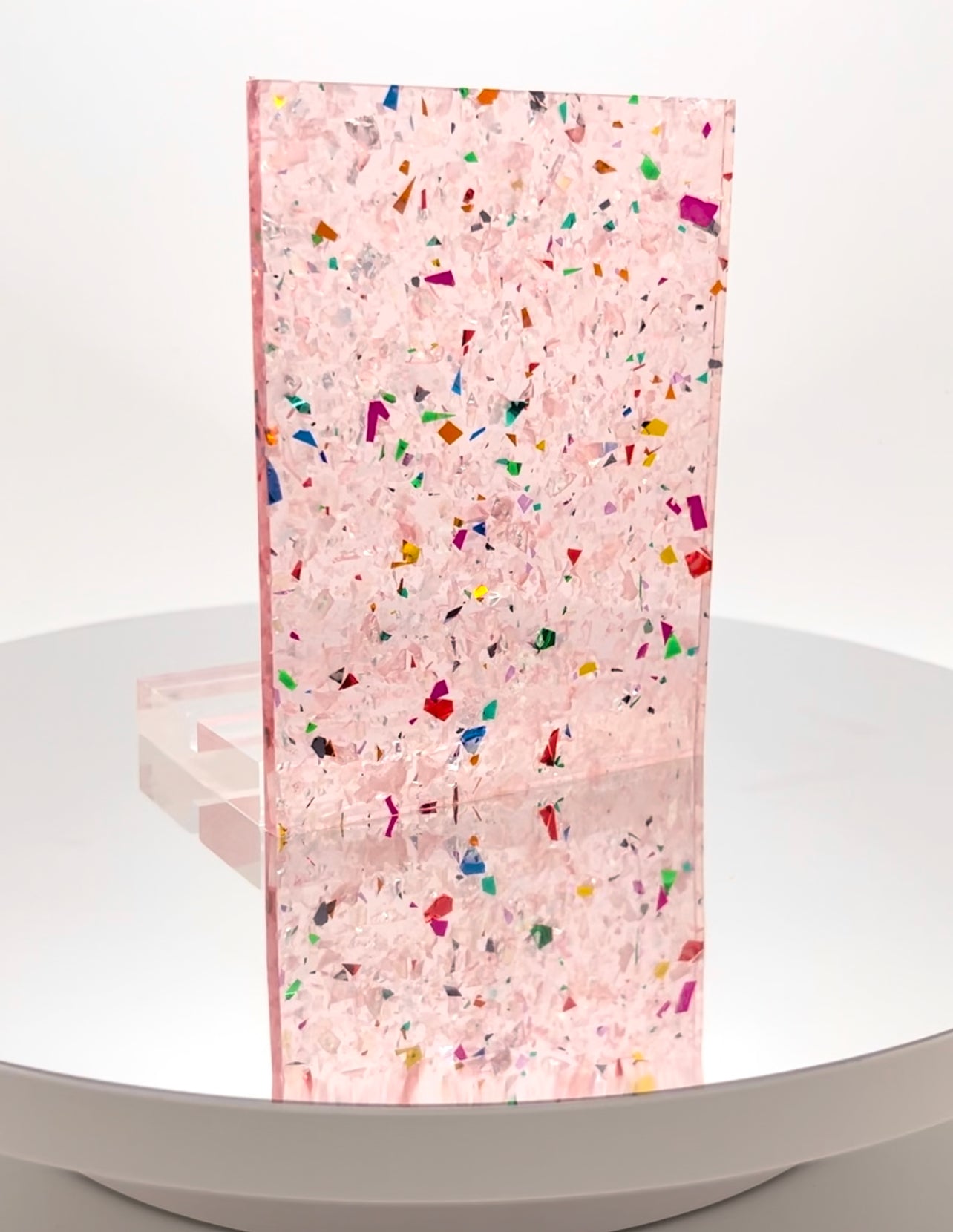 PInk frosted glitter plexiglass with glitter, perfect for creating winter-themed decorations.