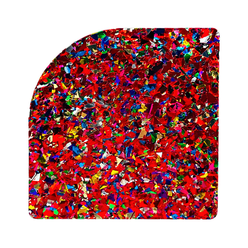 Sequin sheet with red glitter and ruby plexiglass, perfect for creating sparkling decor and artistic projects.